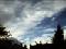 Distorted clouds over roofscenery.