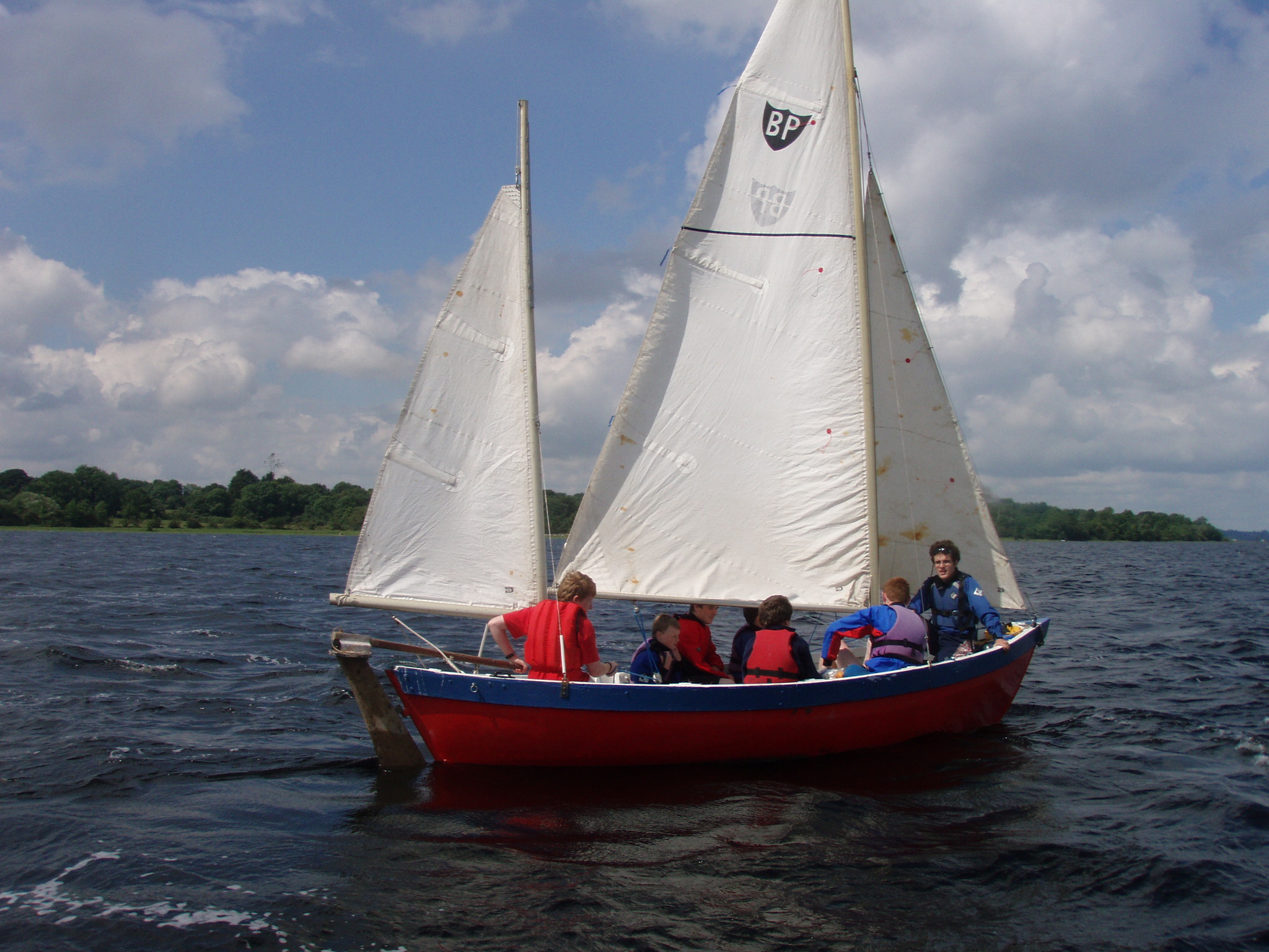 Scouts enjoying a brisk sail on annual camp.