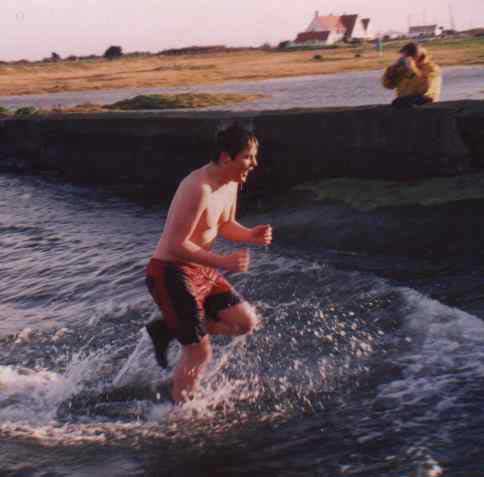 Aonghus Norton dashes to the warmth of the den from the frigidity of the Irish Sea on Christmas afternoon.