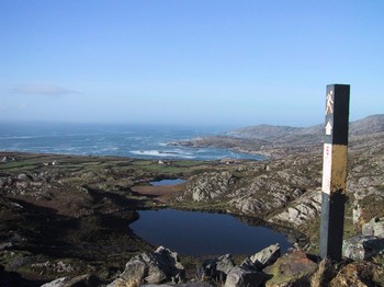 Still lake near the Copper mines. Rough sea in the distance. One of the markers for the Beara way walk.