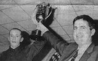 The Dr.Maguire Cup is held aloft at the Ardara dinner dance by captain Eamon Doherty and county chairman, John McConnell.