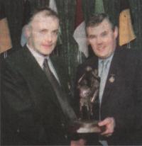 Anthony Molloy, being presented with his award by GAA President Sean McCague