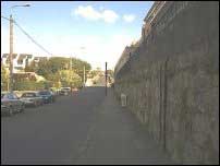 A tall wall on one side, and Bullock harbour on the other
