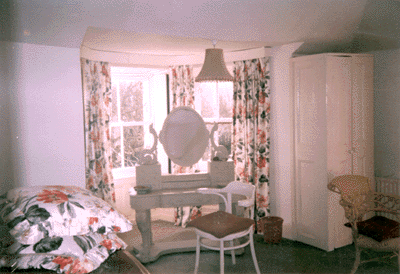 A corner room with a very large double bed